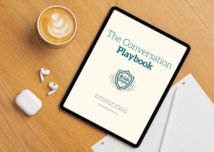 The Conversation Playbook mockup on a tablet, styled on a wood grain desk with coffee and AirPods.